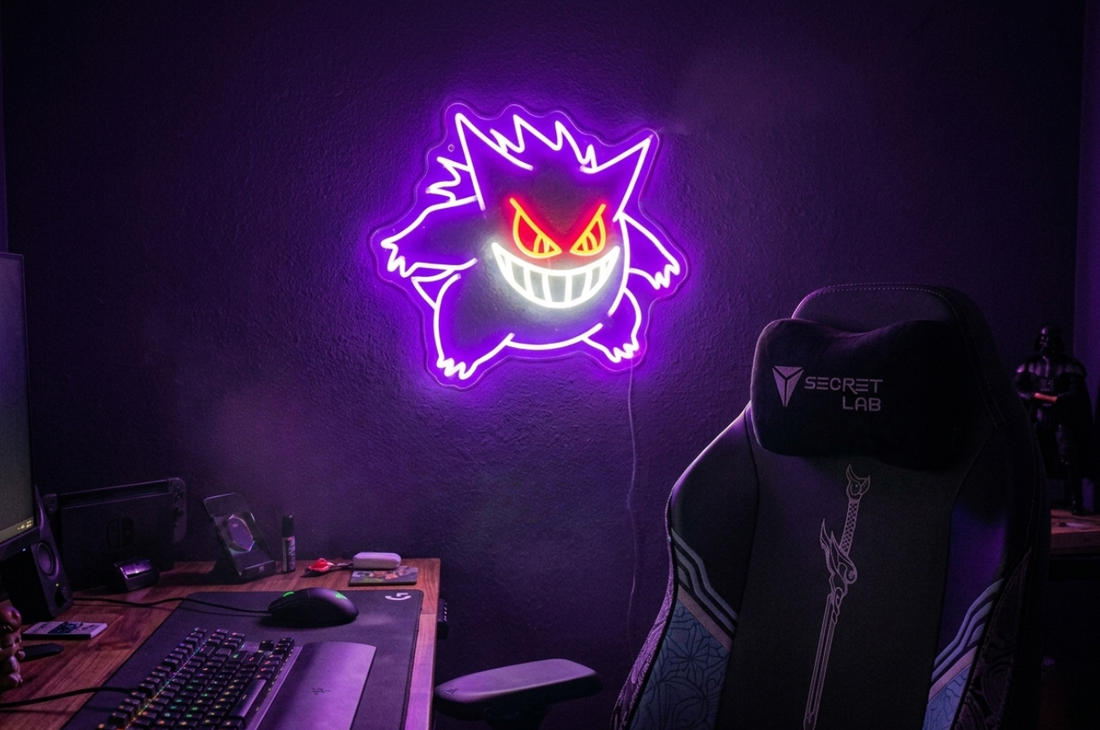 Gengar LED neon sign glowing purple in a dark gaming room setup